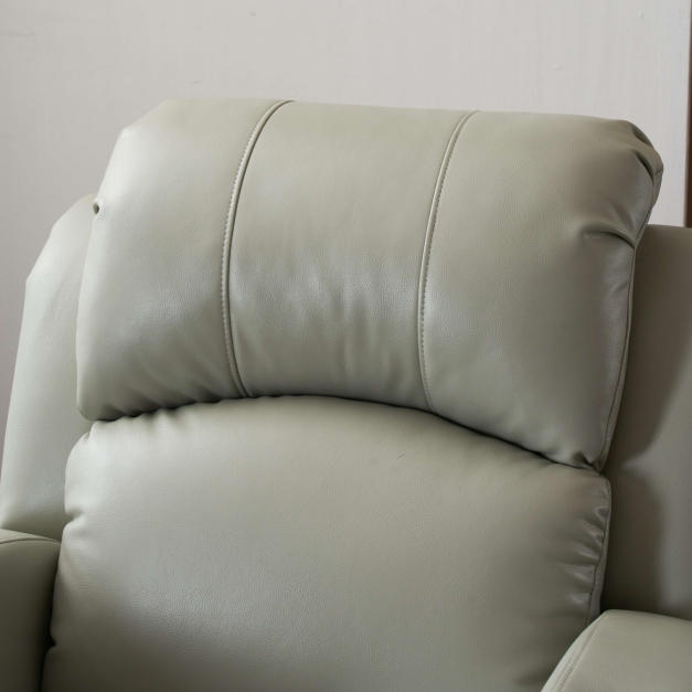 Light grey electric reclining nail spa chair with flip-up armrests, upright position in modern salon Light grey electric reclining nail spa chair with flip-up armrests, upright position in modern salon