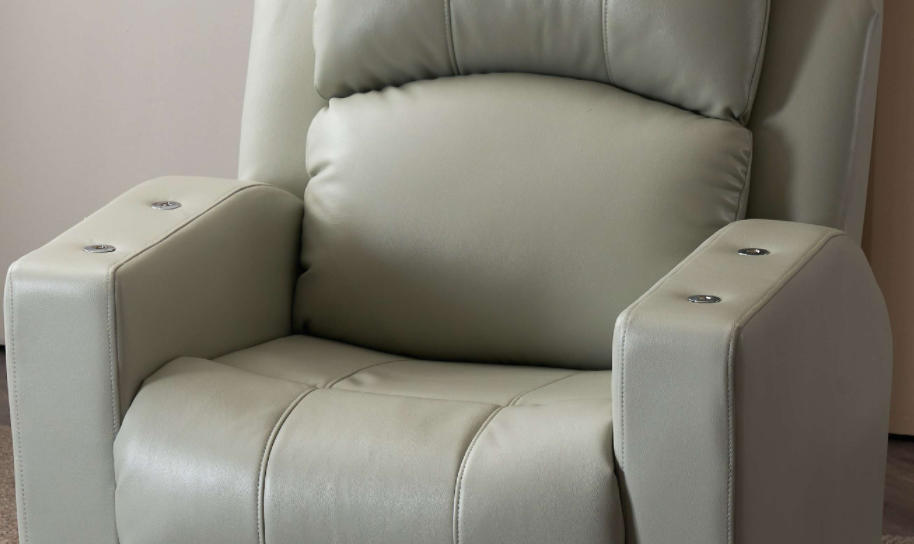 Light grey electric reclining nail spa chair with flip-up armrests, upright position in modern salon Light grey electric reclining nail spa chair with flip-up armrests, upright position in modern salon