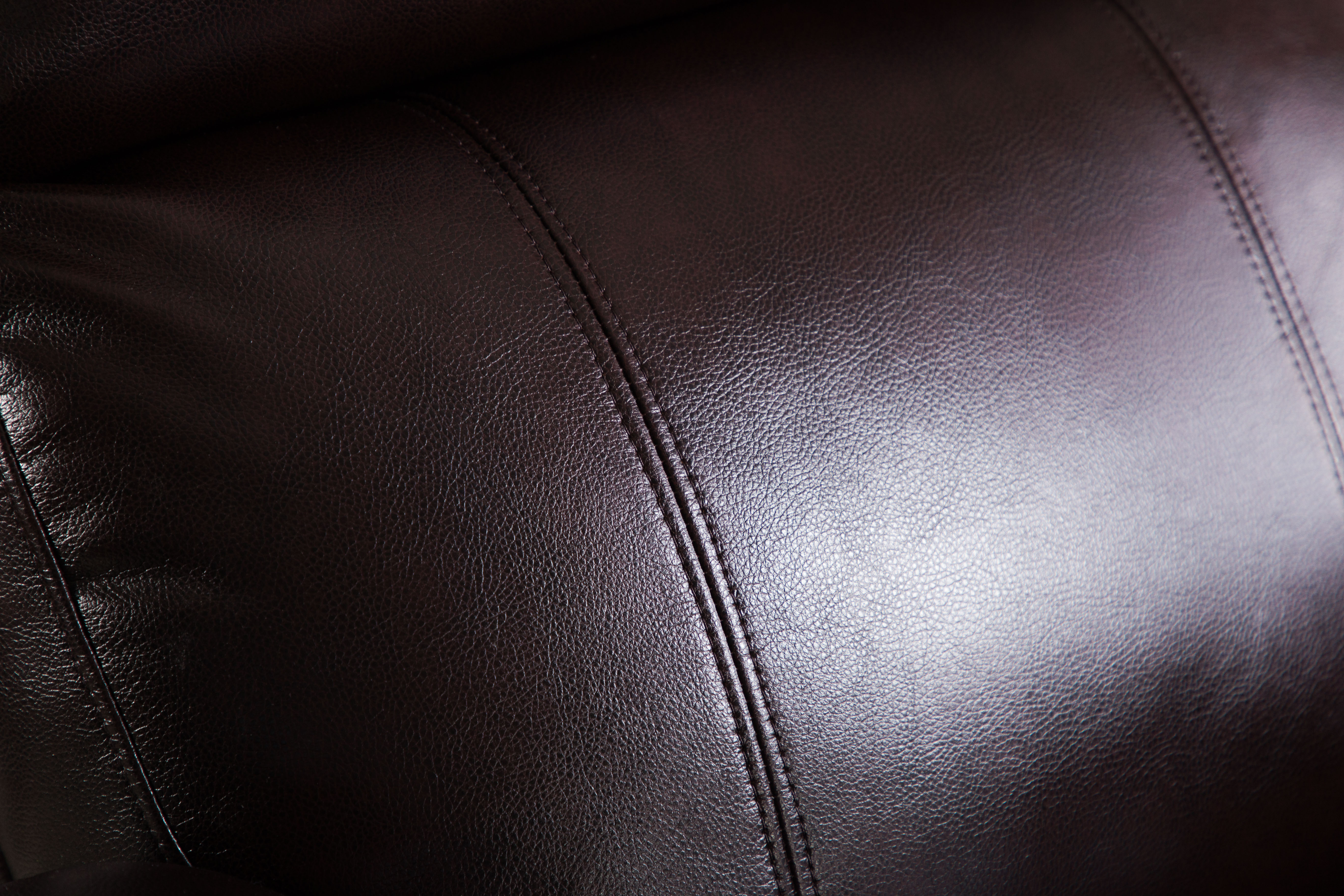 Dark brown manual recliner sofa with convenient side storage pocket