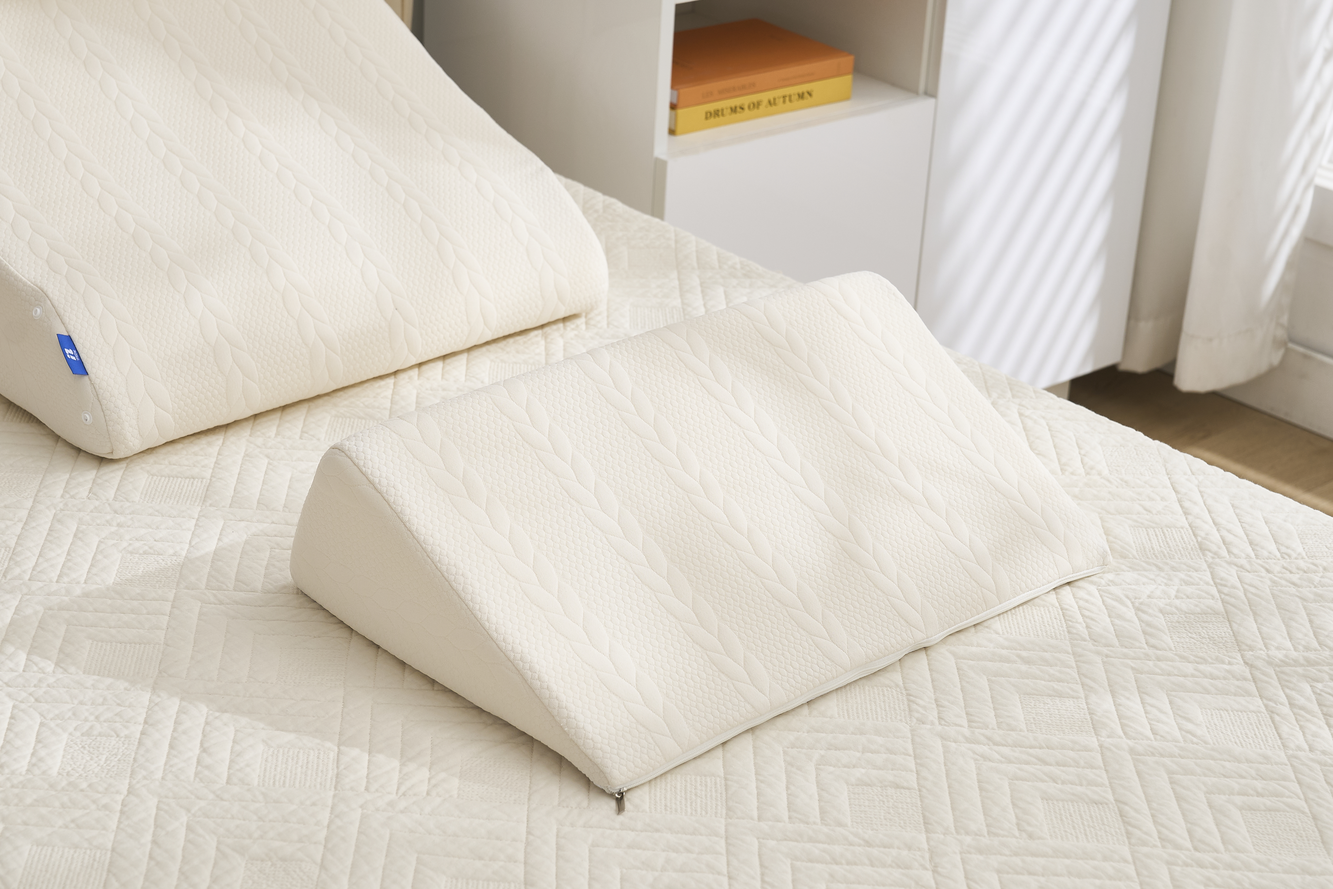 Modular adjustable bed wedge pillow set in cream color, 2-piece combination on bed Modular adjustable bed wedge pillow set in cream color, 2-piece combination on bed